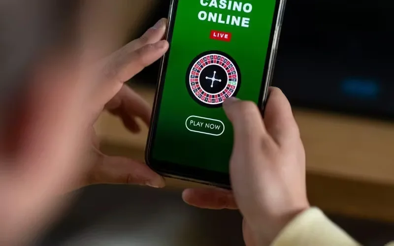 A stylish Bengali player exploring the vast 5666Bet mobile library on their phone.